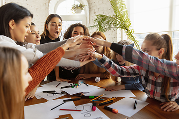 Image showing Young people discussing about women rights and equality at the office