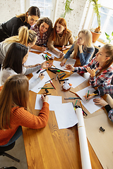 Image showing Young people discussing about women rights and equality at the office