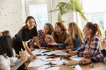 Image showing Young people discussing about women rights and equality at the office