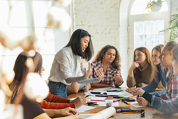 Image showing Young people discussing about women rights and equality at the office