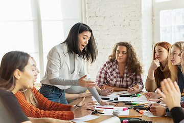 Image showing Young people discussing about women rights and equality at the office