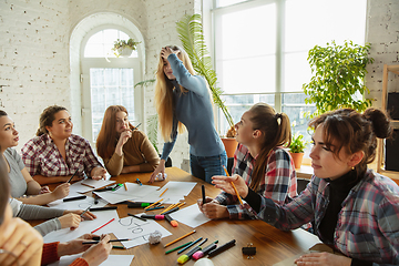 Image showing Young people discussing about women rights and equality at the office