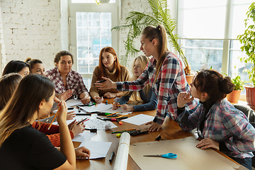 Image showing Young people discussing about women rights and equality at the office