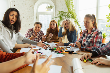 Image showing Young people discussing about women rights and equality at the office