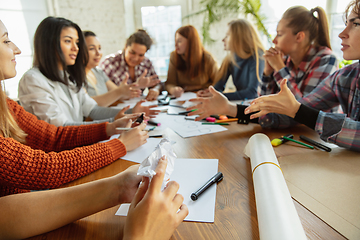 Image showing Young people discussing about women rights and equality at the office