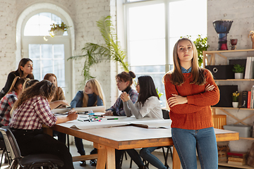 Image showing Young people discussing about women rights and equality at the office