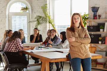 Image showing Young people discussing about women rights and equality at the office