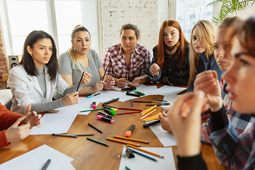 Image showing Young people discussing about women rights and equality at the office