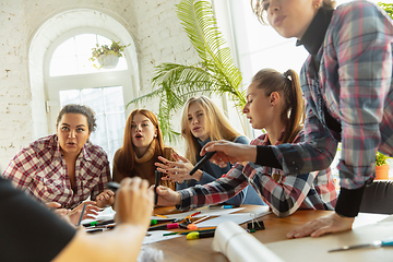 Image showing Young people discussing about women rights and equality at the office