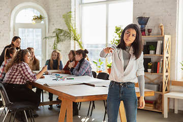 Image showing Young people discussing about women rights and equality at the office