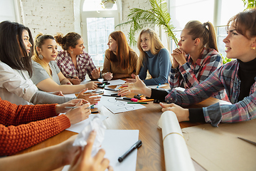 Image showing Young people discussing about women rights and equality at the office