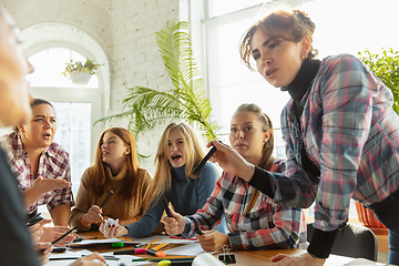 Image showing Young people discussing about women rights and equality at the office