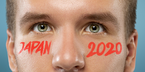 Image showing Caucasian young man\'s close up portrait on bright background, Tokyo 2020