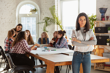 Image showing Young people discussing about women rights and equality at the office