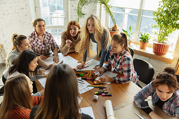 Image showing Young people discussing about women rights and equality at the office