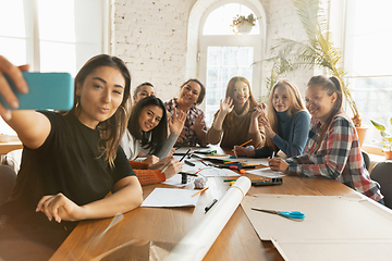 Image showing Young people discussing about women rights and equality at the office