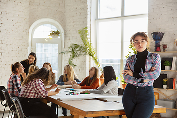 Image showing Young people discussing about women rights and equality at the office