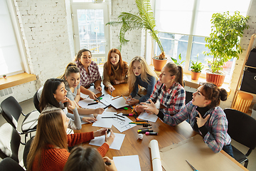 Image showing Young people discussing about women rights and equality at the office