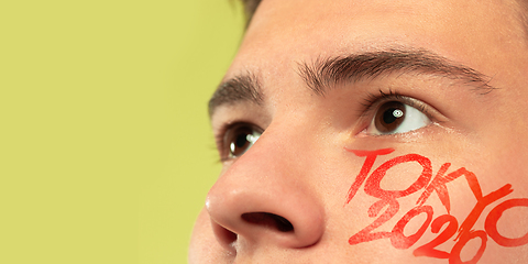 Image showing Caucasian young man\'s close up portrait on bright background, Tokyo 2020