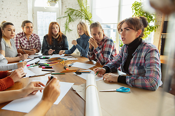 Image showing Young people discussing about women rights and equality at the office