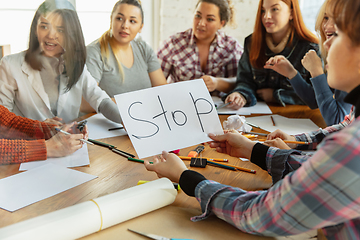 Image showing Young people discussing about women rights and equality at the office