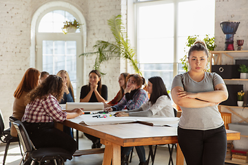 Image showing Young people discussing about women rights and equality at the office