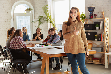 Image showing Young people discussing about women rights and equality at the office