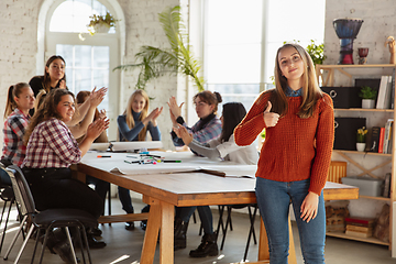 Image showing Young people discussing about women rights and equality at the office