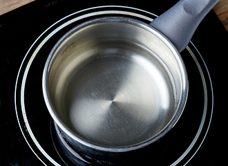 Image showing kettle of water on electric induction hob