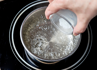 Image showing salt is added to boiling water