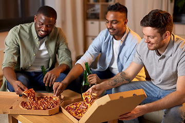 Image showing happy male friends with beer eating pizza at home