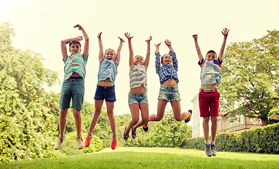 Image showing happy kids jumping and having fun in summer park
