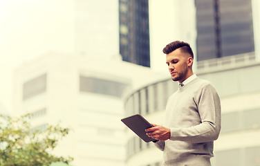 Image showing man with tablet pc computer in city