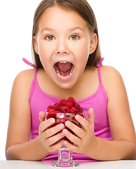 Image showing Little girl with raspberries