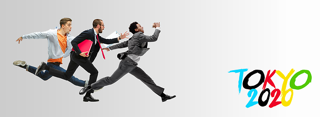 Image showing Office workers or ballet dancers jumping on white background