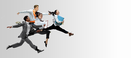 Image showing Office workers or ballet dancers jumping on white background