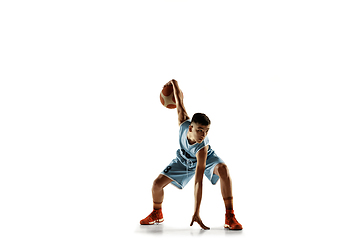 Image showing Full length portrait of a young basketball player with ball