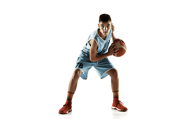 Image showing Full length portrait of a young basketball player with ball