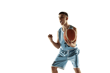 Image showing Full length portrait of a young basketball player with ball