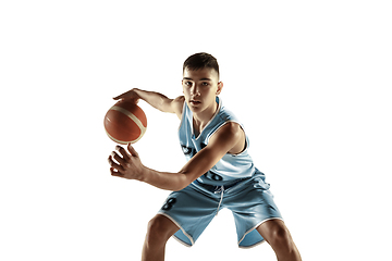 Image showing Full length portrait of a young basketball player with ball