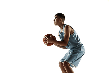 Image showing Full length portrait of a young basketball player with ball