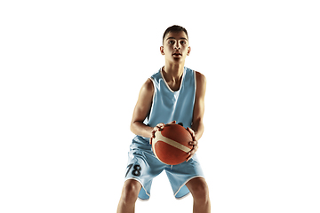 Image showing Full length portrait of a young basketball player with ball