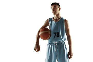 Image showing Full length portrait of a young basketball player with ball