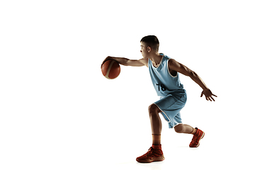 Image showing Full length portrait of a young basketball player with ball