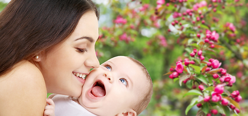 Image showing mother with baby over spring garden background
