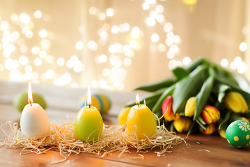 Image showing candles in shape of easter eggs and tulip flowers