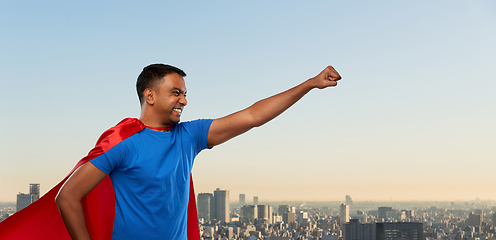 Image showing indian man in superhero cape makes winning gesture