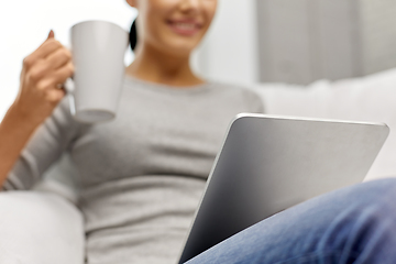 Image showing close up of woman with tablet pc computer at home