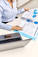 Image showing businesswoman with papers working at office