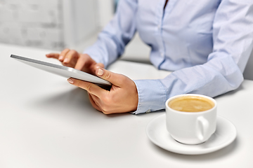 Image showing businesswoman with tablet pc and coffee at office